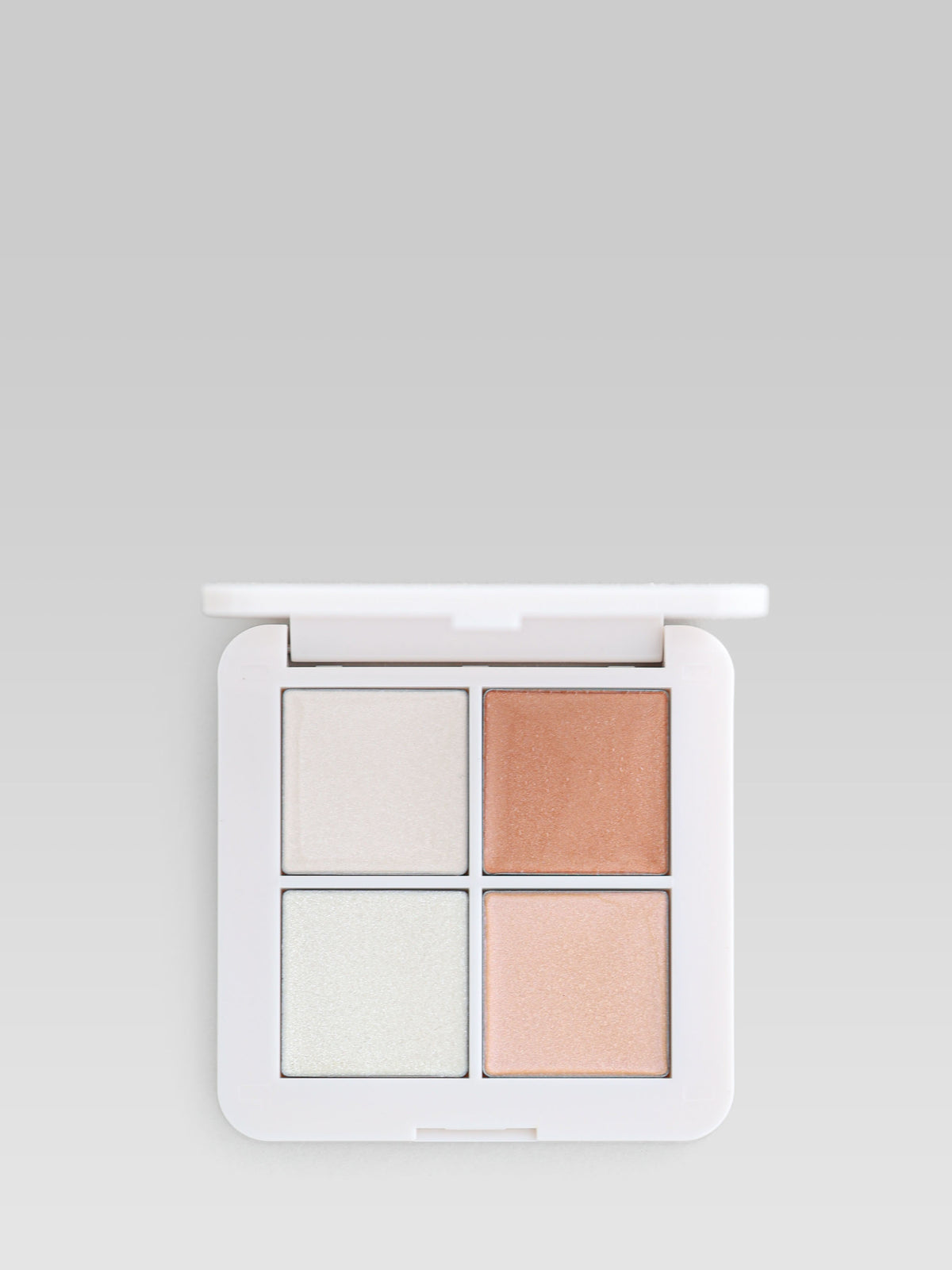 RMS Beauty Signature Set Luminizer X Quad with four highlighter and bronzer shades in white compact packaging