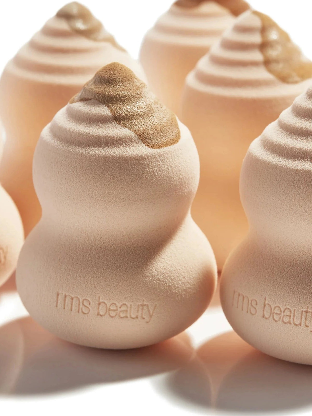 RMS Beauty Skin2Skin Beauty Sponges in a close-up showing their soft, sculpted shape and textured surface