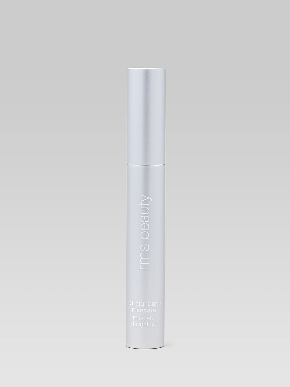 RMS Beauty Straight Up Volumizing Peptide Mascara in a sleek silver tube, shown against a light background
