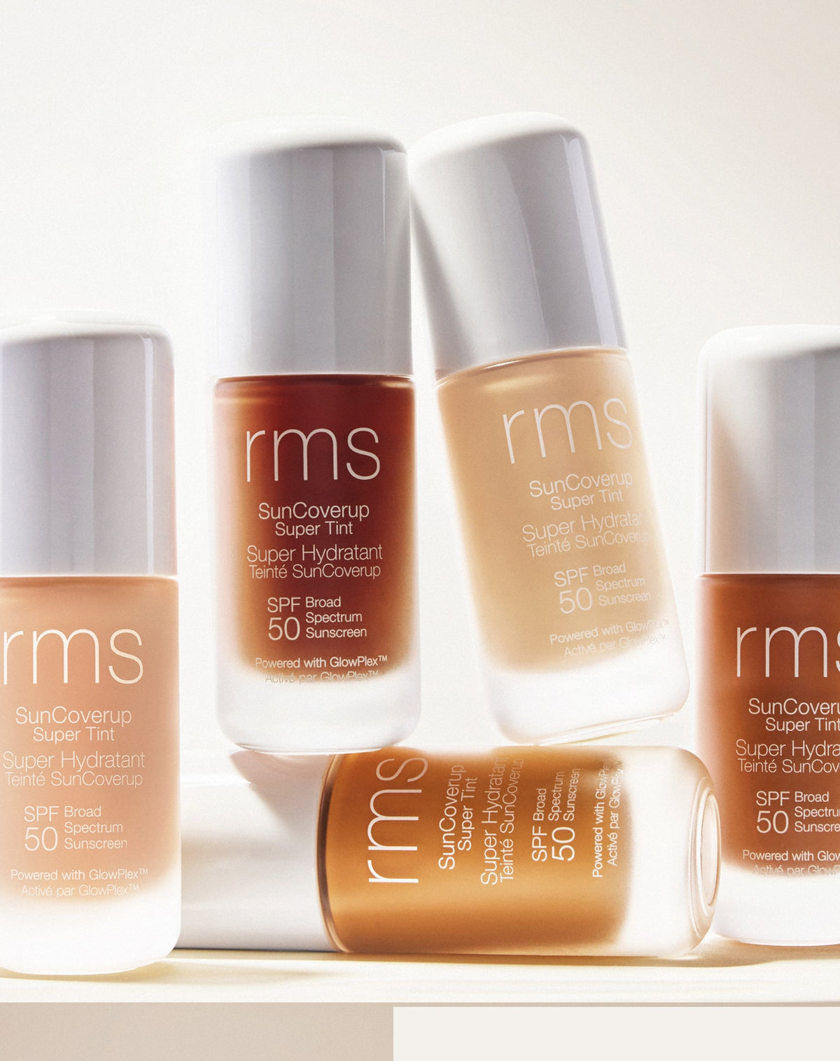 RMS Beauty SunCoverup Super Tint SPF 50 in different shades arranged together in natural light