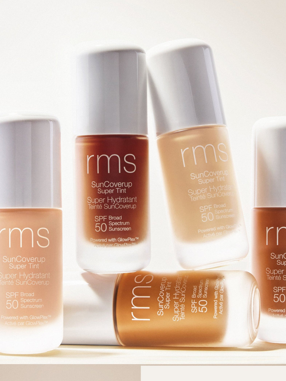 RMS Beauty SunCoverup Super Tint SPF 50 in different shades arranged together in natural light