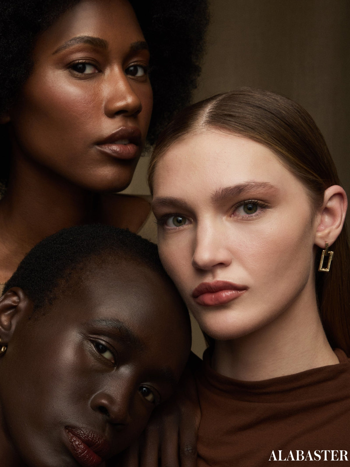 Three models showcasing RMS Beauty SunCoverup Super Tint SPF 50 in Mahogany, Mocha and Alabaster