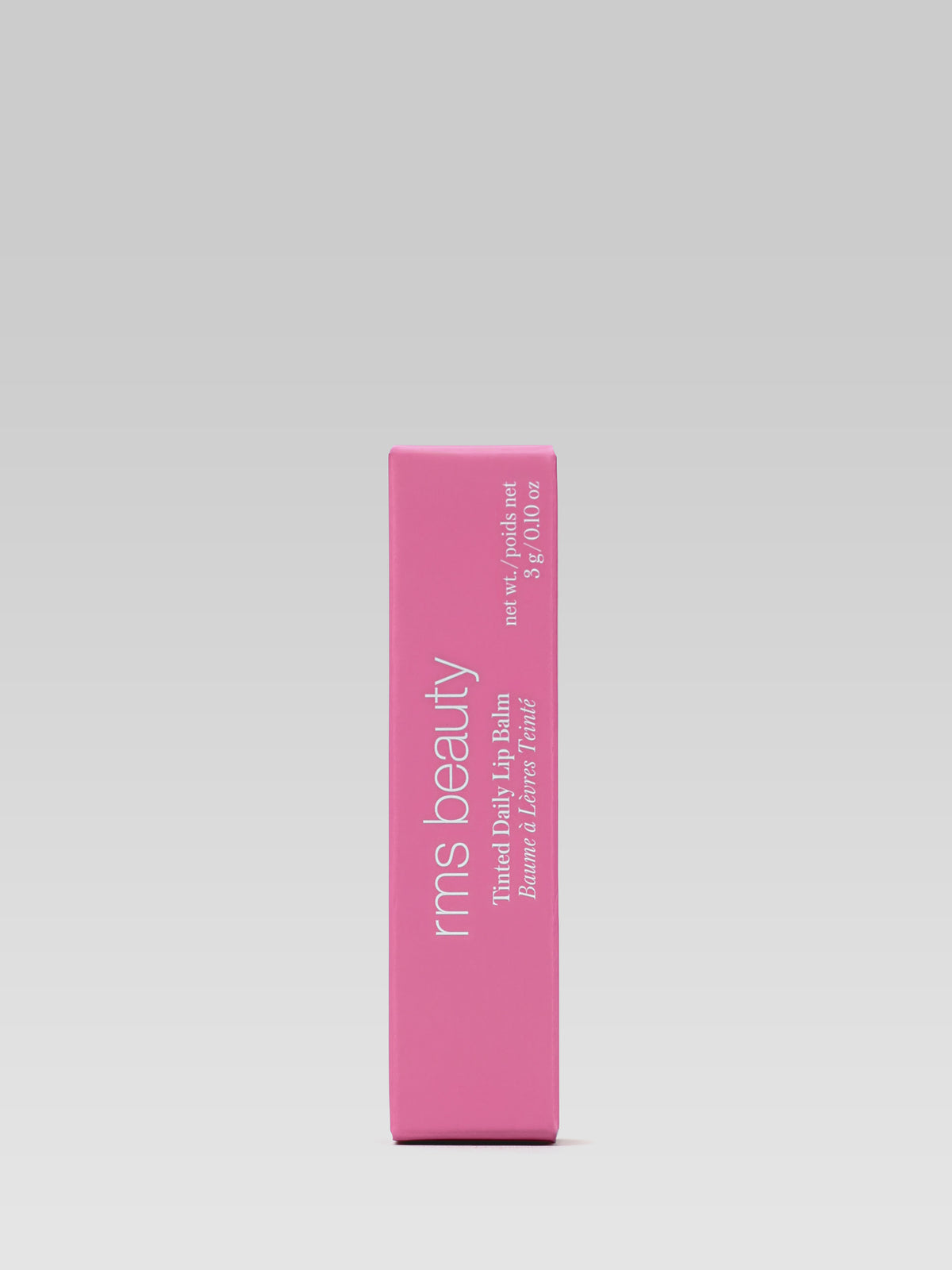RMS Beauty Tinted Daily Lip Balm in Destiny Lane, pink product box with white RMS Beauty branding on a light grey background