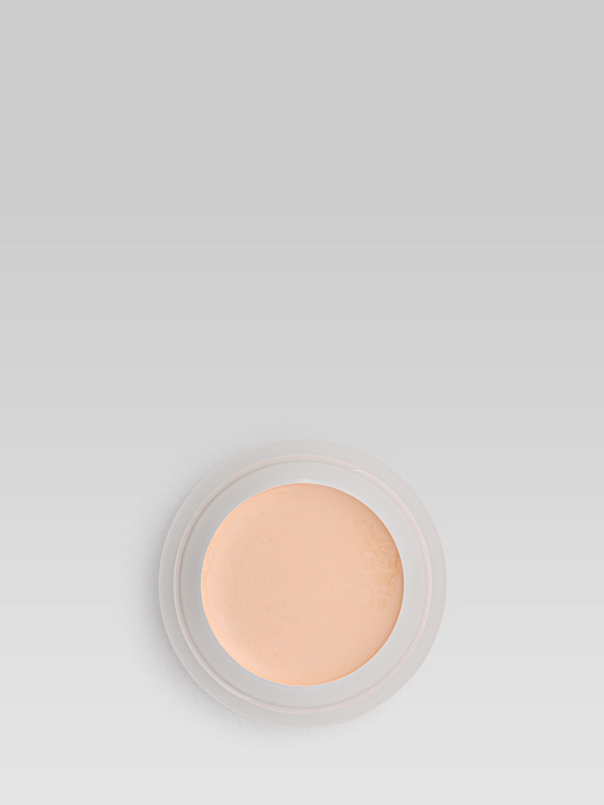 RMS Beauty UnCoverup Concealer in shade 00, shown in an open round pot with a light peach-beige cream formula against a light grey background