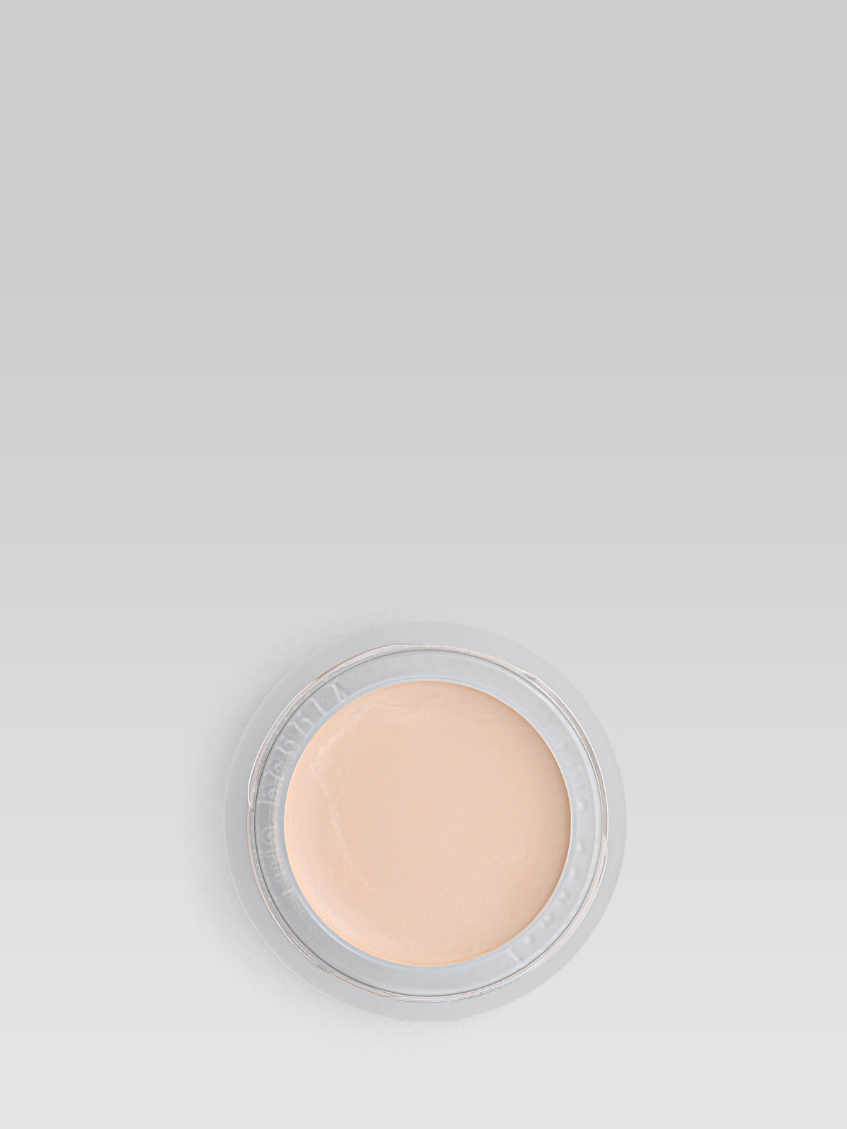 RMS Beauty UnCoverup Concealer in shade 000, shown in an open round pot with a light beige cream formula against a light grey background