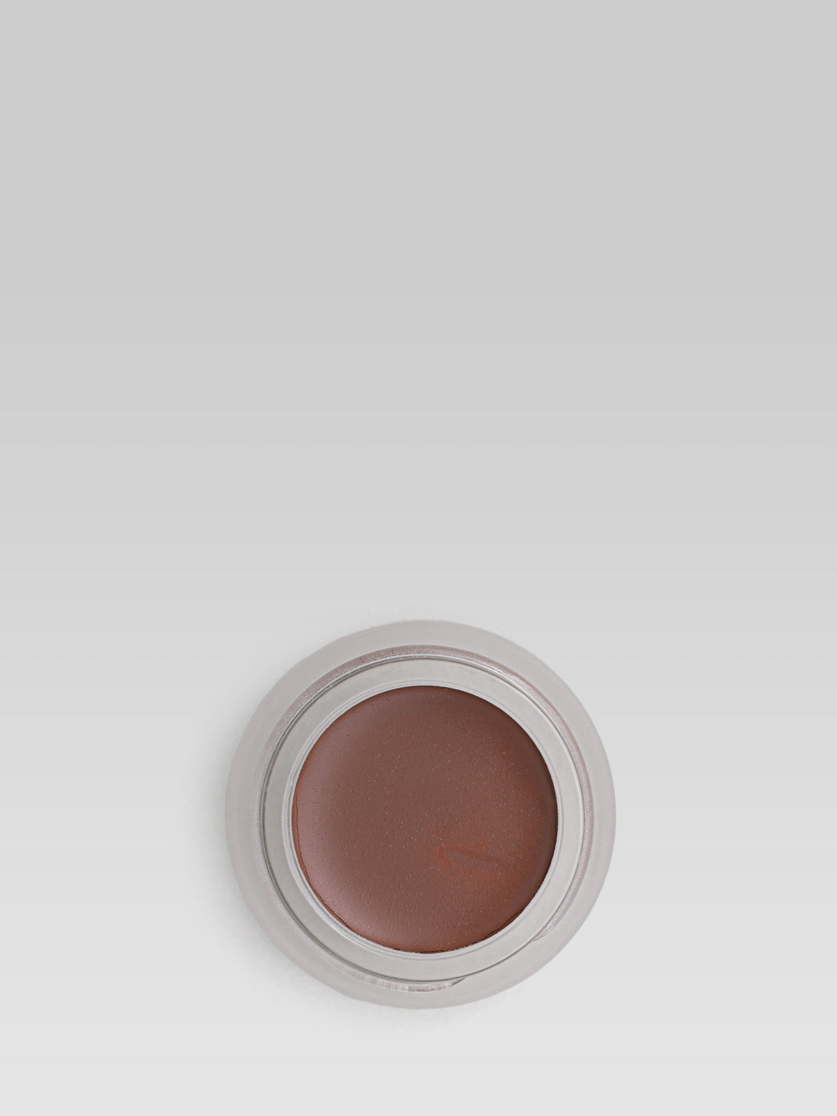 RMS Beauty UnCoverup Concealer in shade 122, shown in an open round pot with a medium-deep, warm brown cream concealer against a light grey background