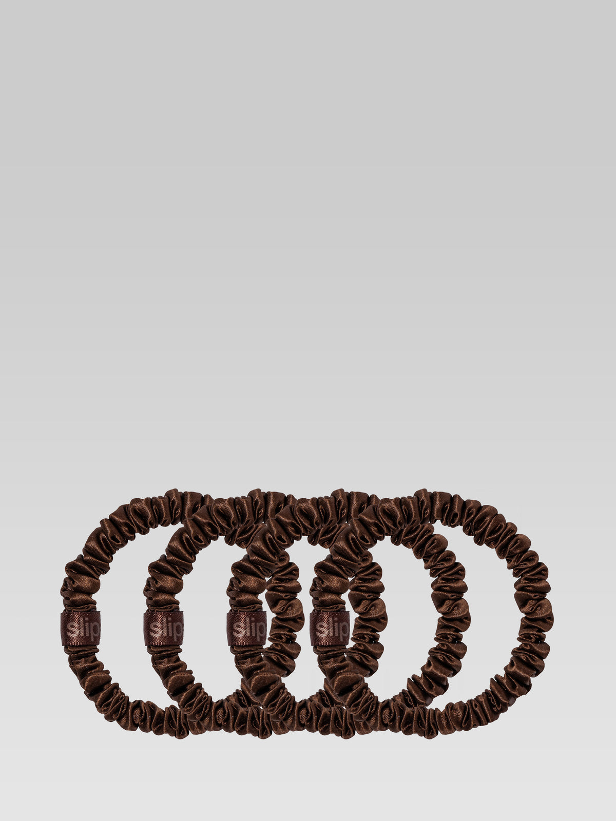 SLIP Back To Basics Skinny Scrunchies in Dark Brown, shown in a set of five slim silk hair ties.