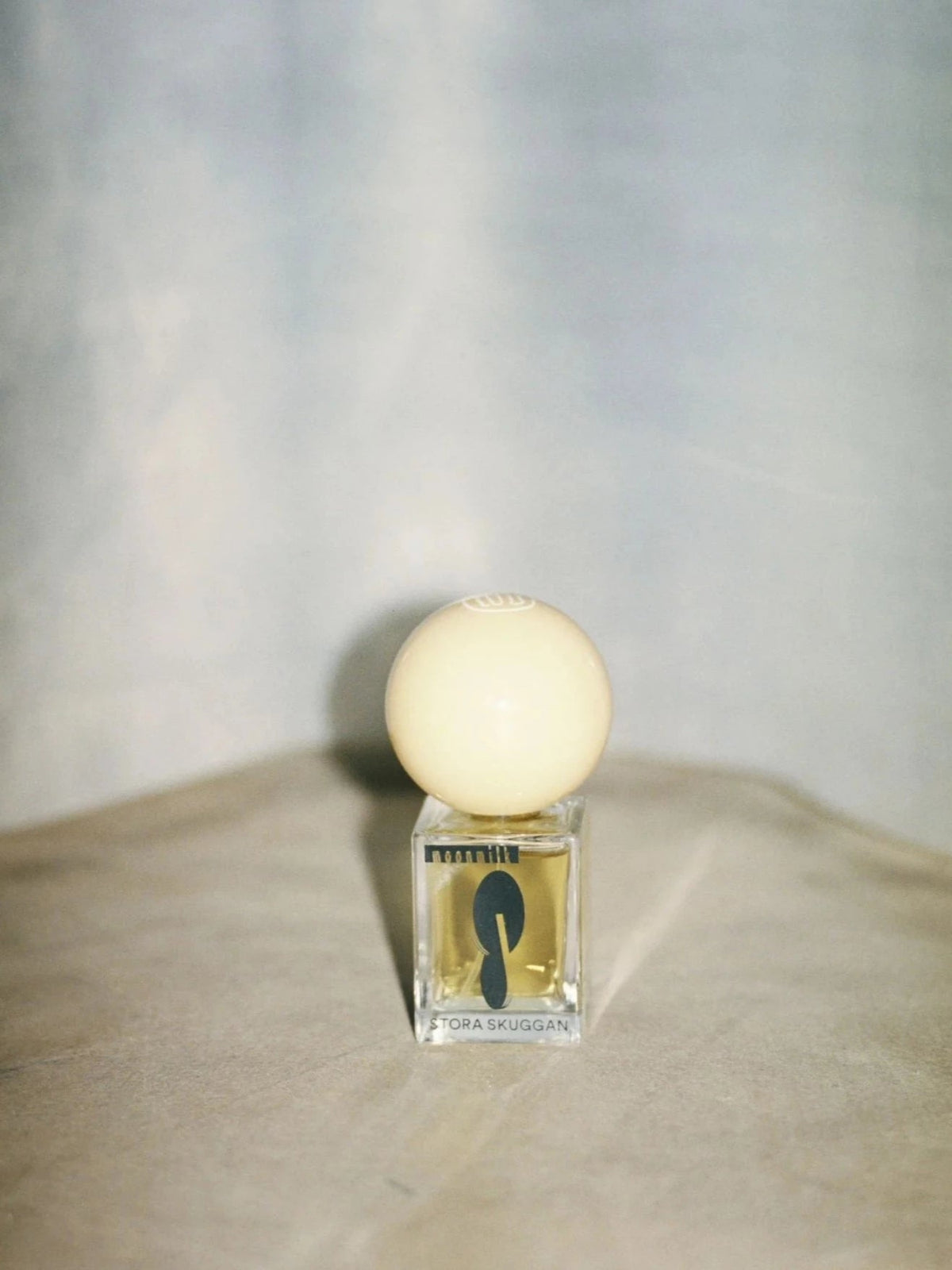Stora Skuggan Moonmilk Eau de Parfum bottle in a soft natural setting