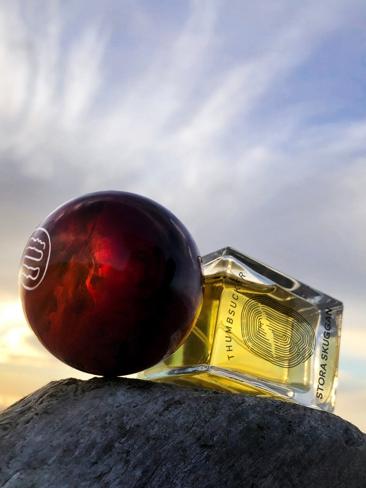 Stora Skuggan Thumbsucker Eau de Parfum bottle on a rock