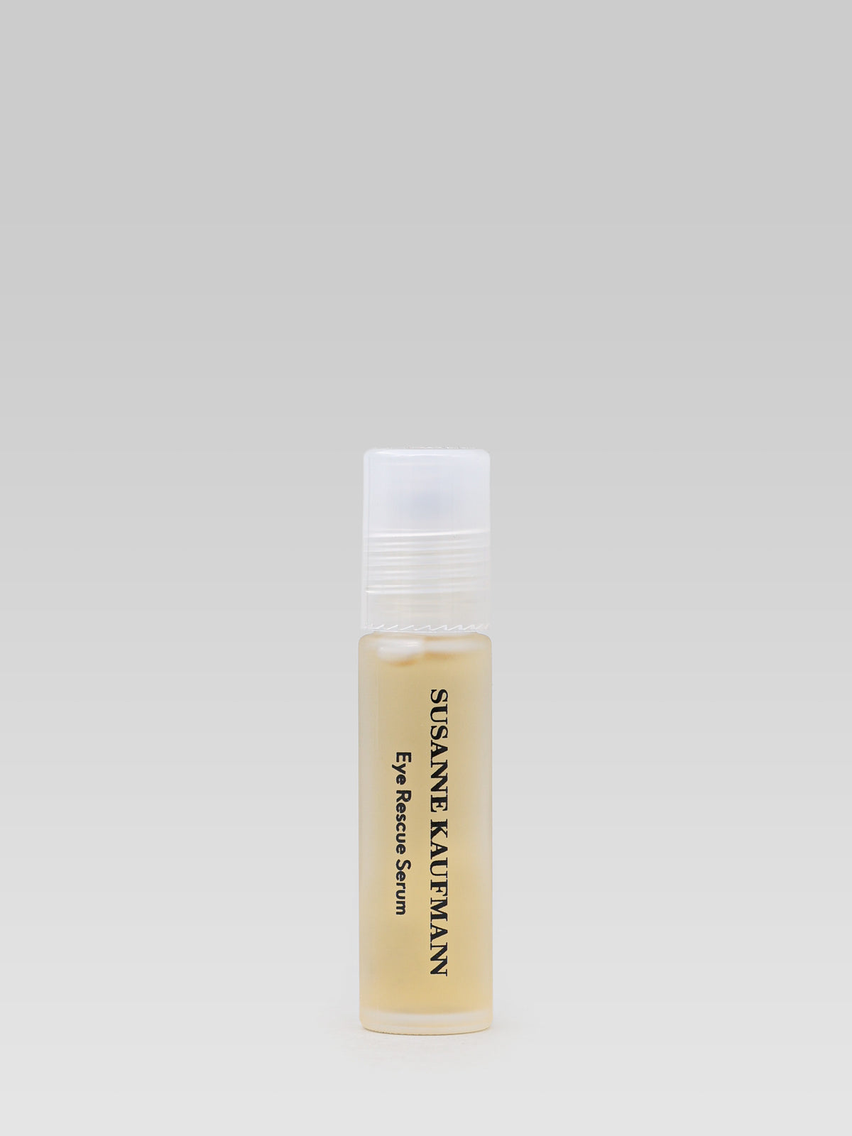 Susanne Kaufmann Eye Rescue Serum in a small glass bottle with a white cap