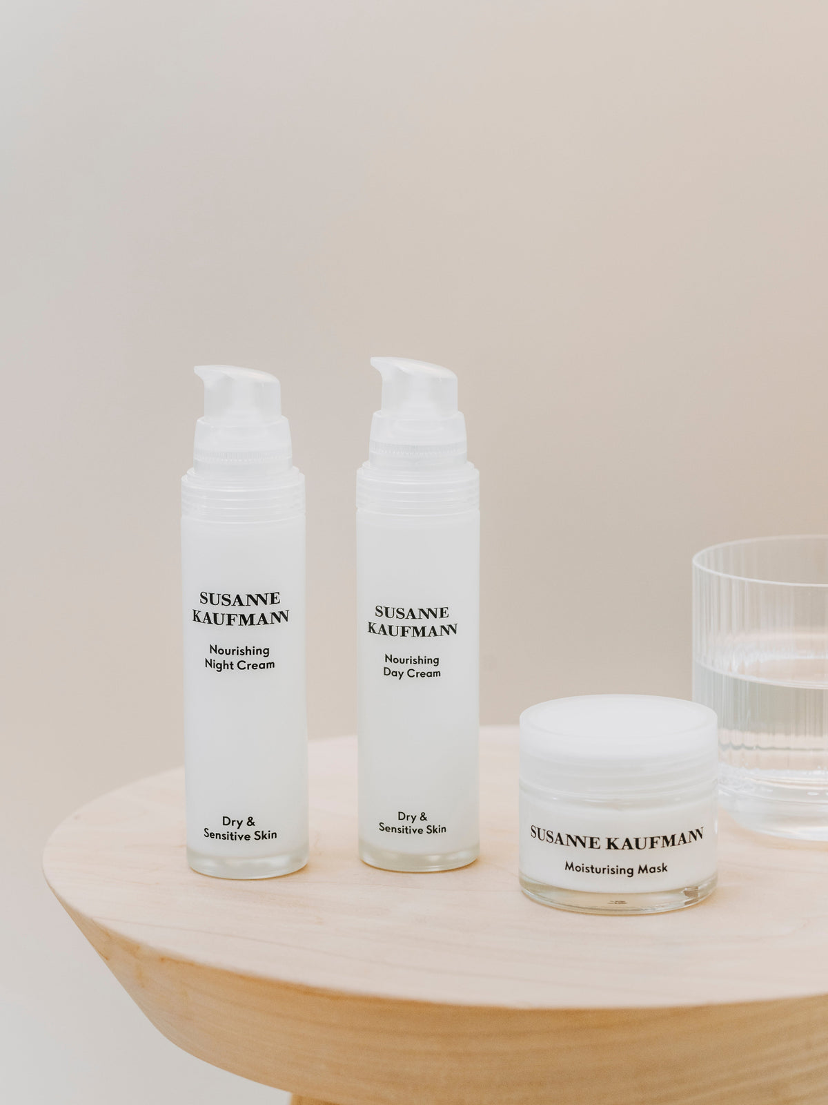 Susanne Kaufmann Nourishing Night Cream, Moisturising Day Cream and Moisturising Mask displayed together on a wooden table