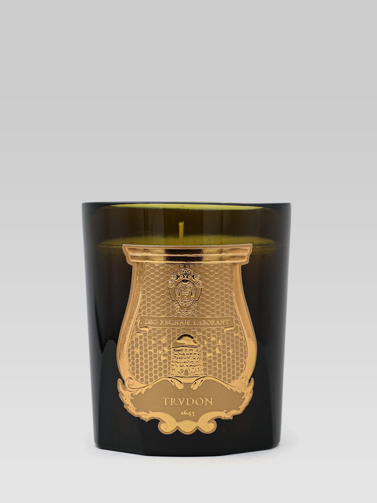 Trudon Abd El Kader scented candle in a black glass with gold emblem