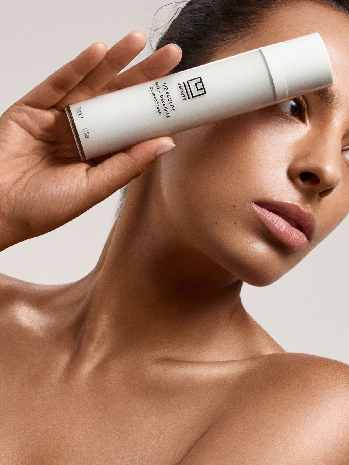 U Beauty The Sculpt Neck + Décolleté Concentrate applied to neck and décolleté