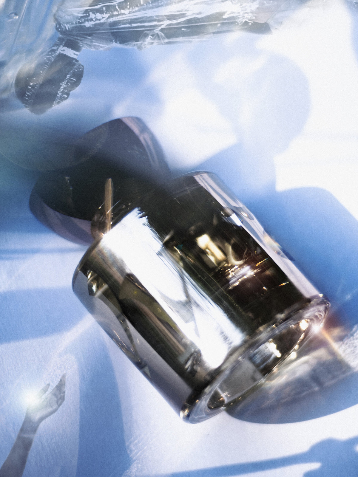 VYRAO The Sixth Eau de Parfum bottle in an artistic blue and silver setting