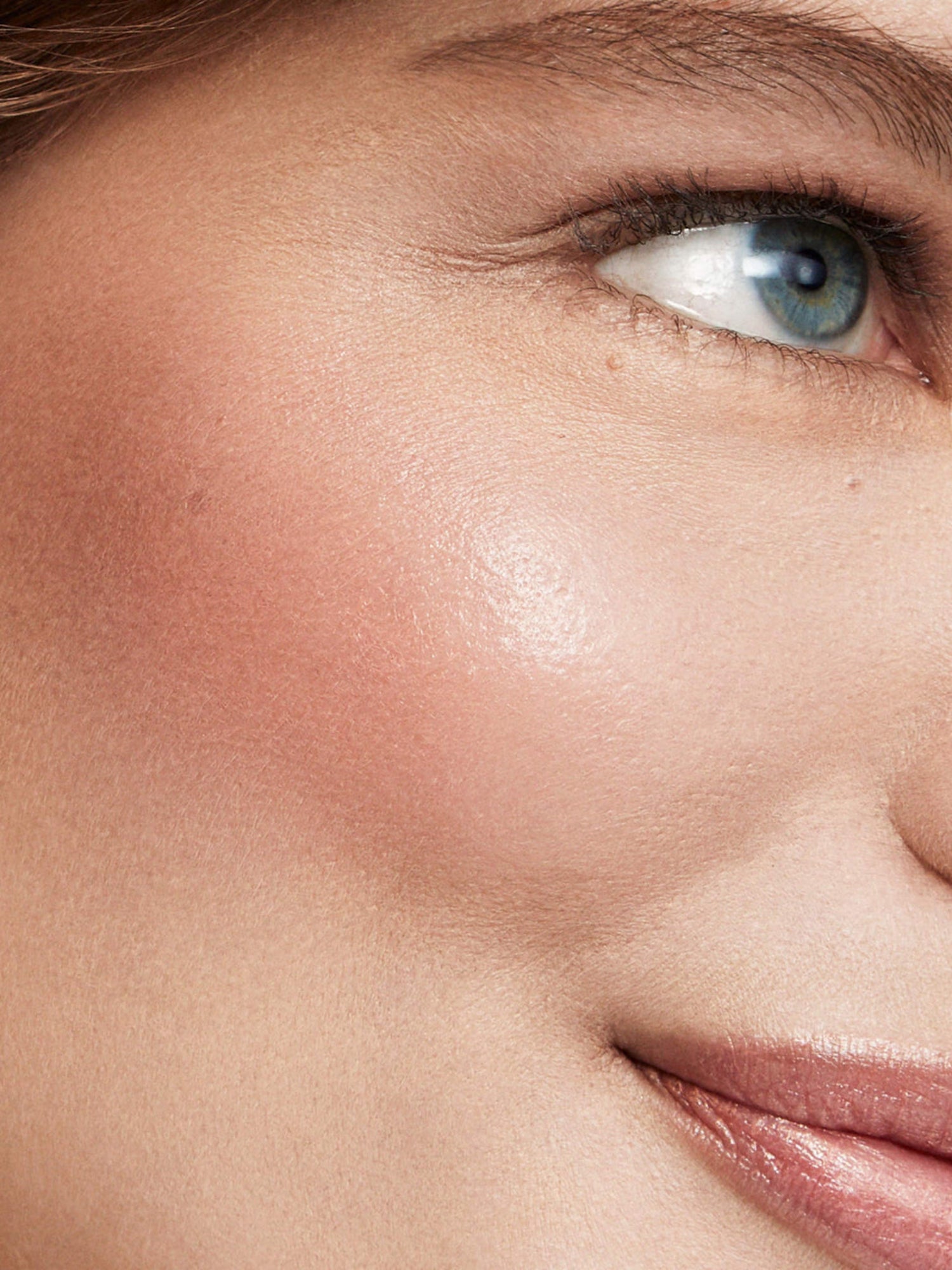 Westman Atelier Baby Cheeks Blush Stick in Minette on cheek close-up