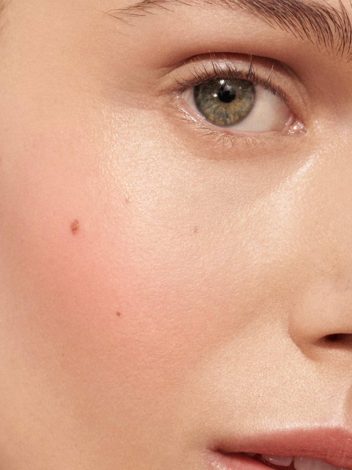 Westman Atelier Baby Cheeks Blush Stick in Minette on cheek