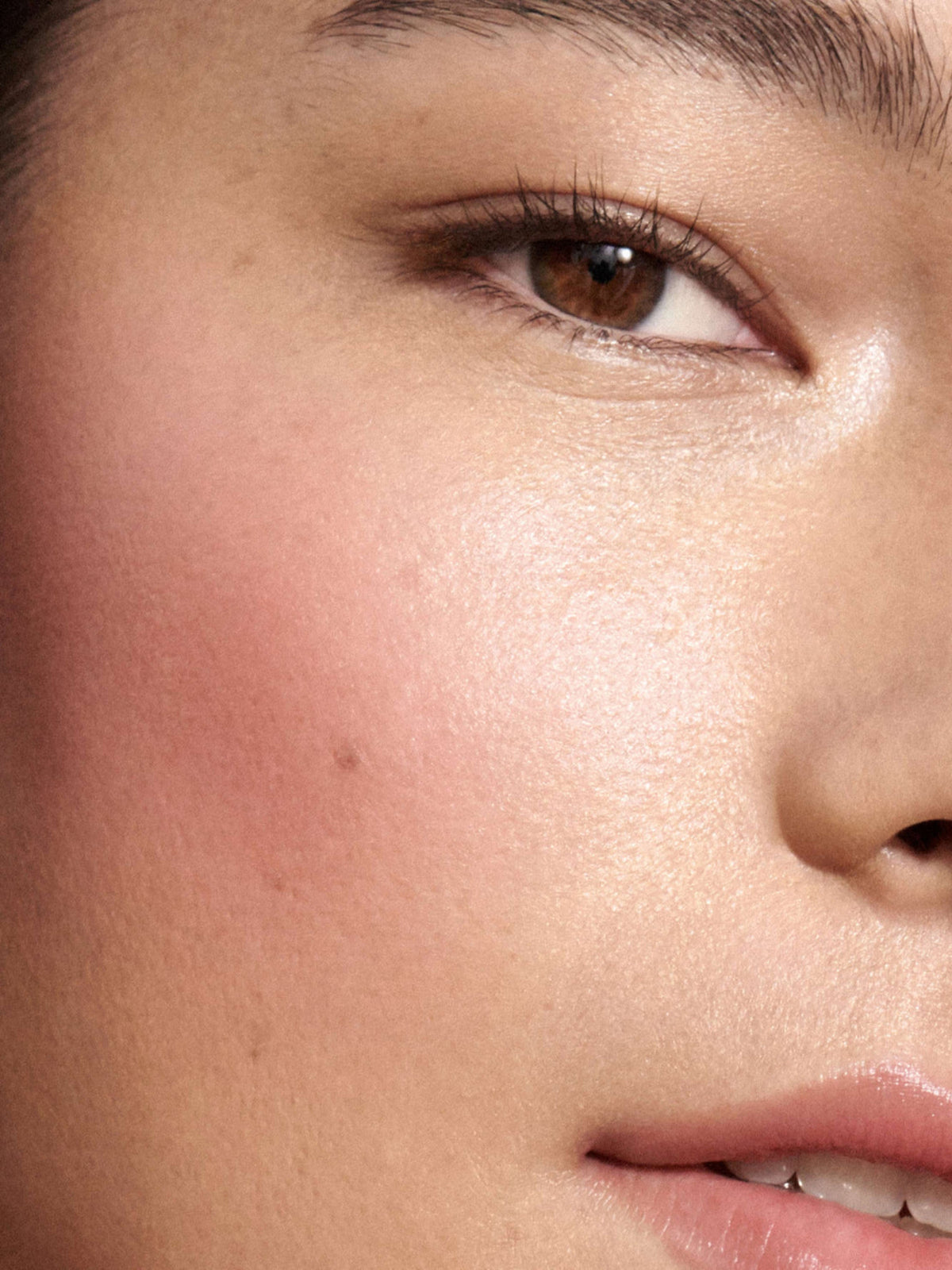 Westman Atelier Baby Cheeks Blush Stick in Petal on cheek