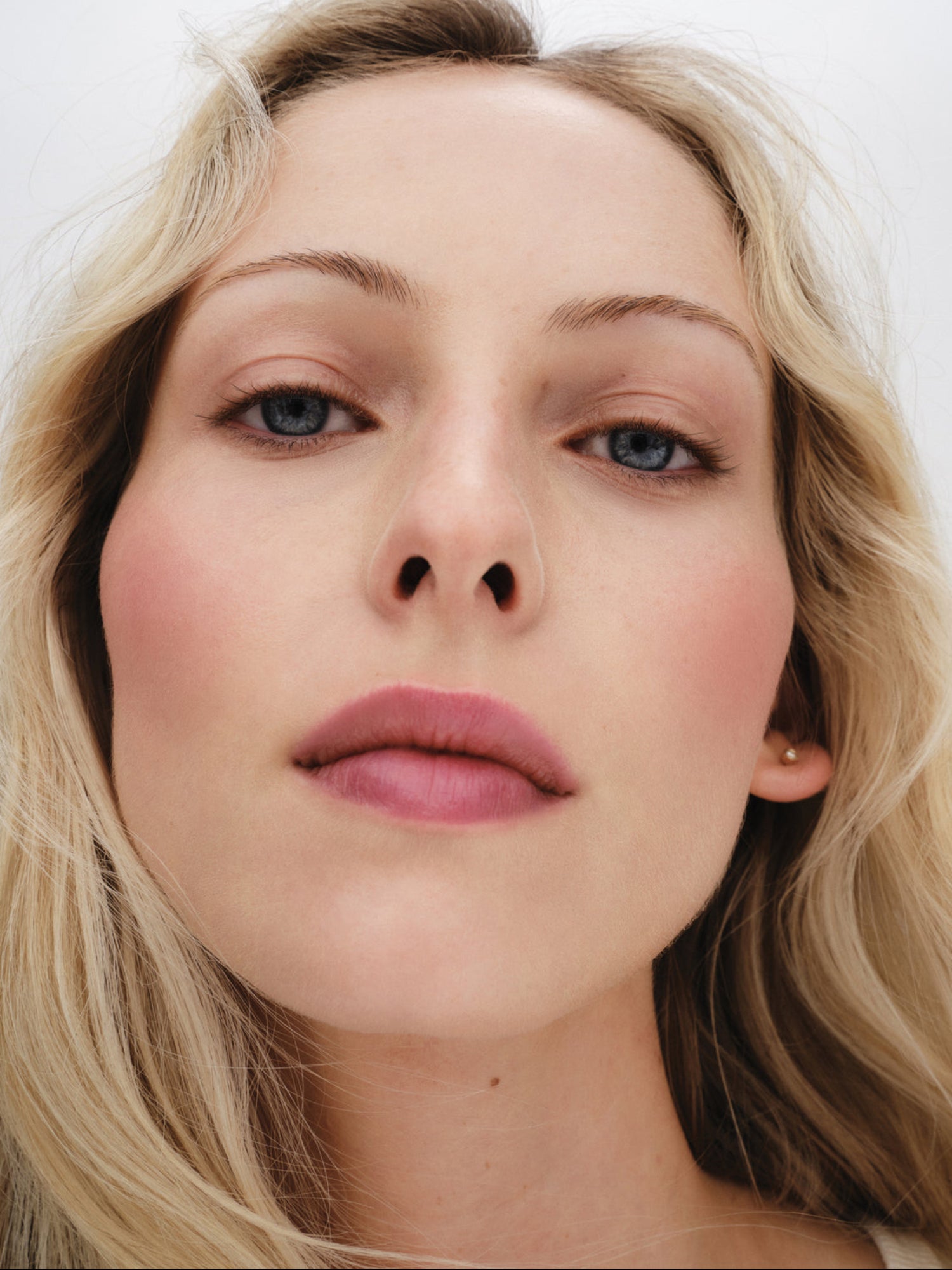 Westman Atelier Baby Cheeks Blush Stick in Petal on model