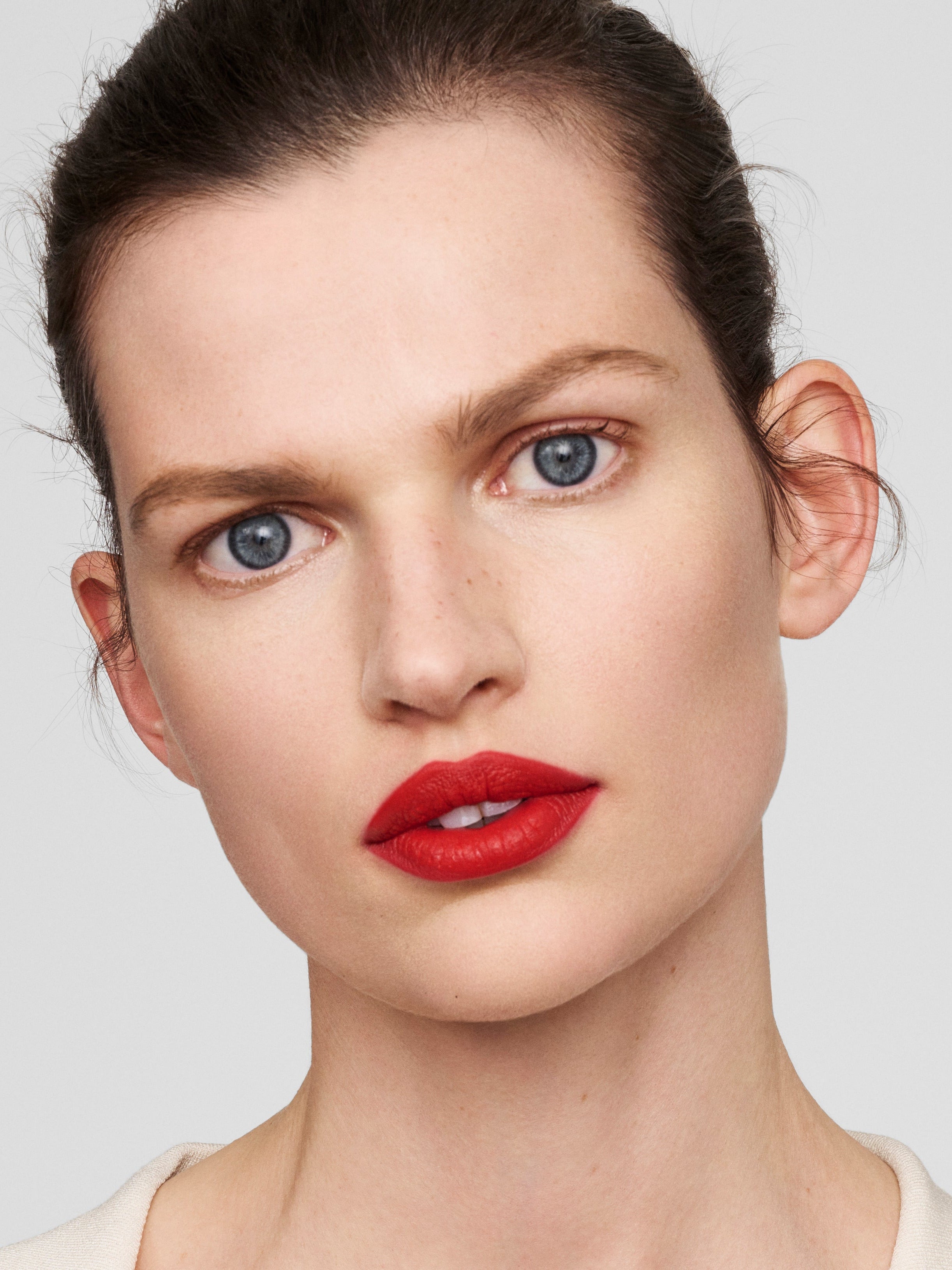 Westman Atelier Lip Suede Matte Lipstick in Le Rouge on lips
