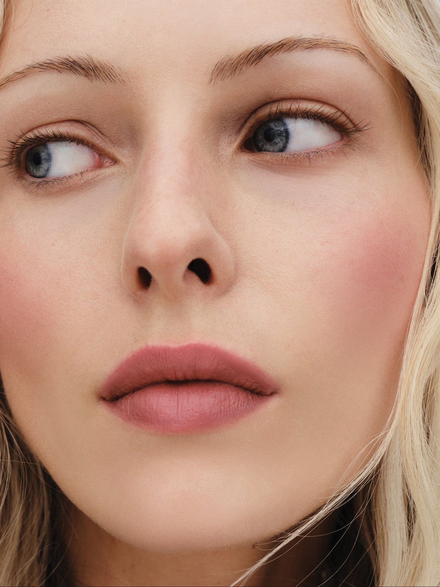 Westman Atelier Lip Suede Matte Lipstick in Petal on lips