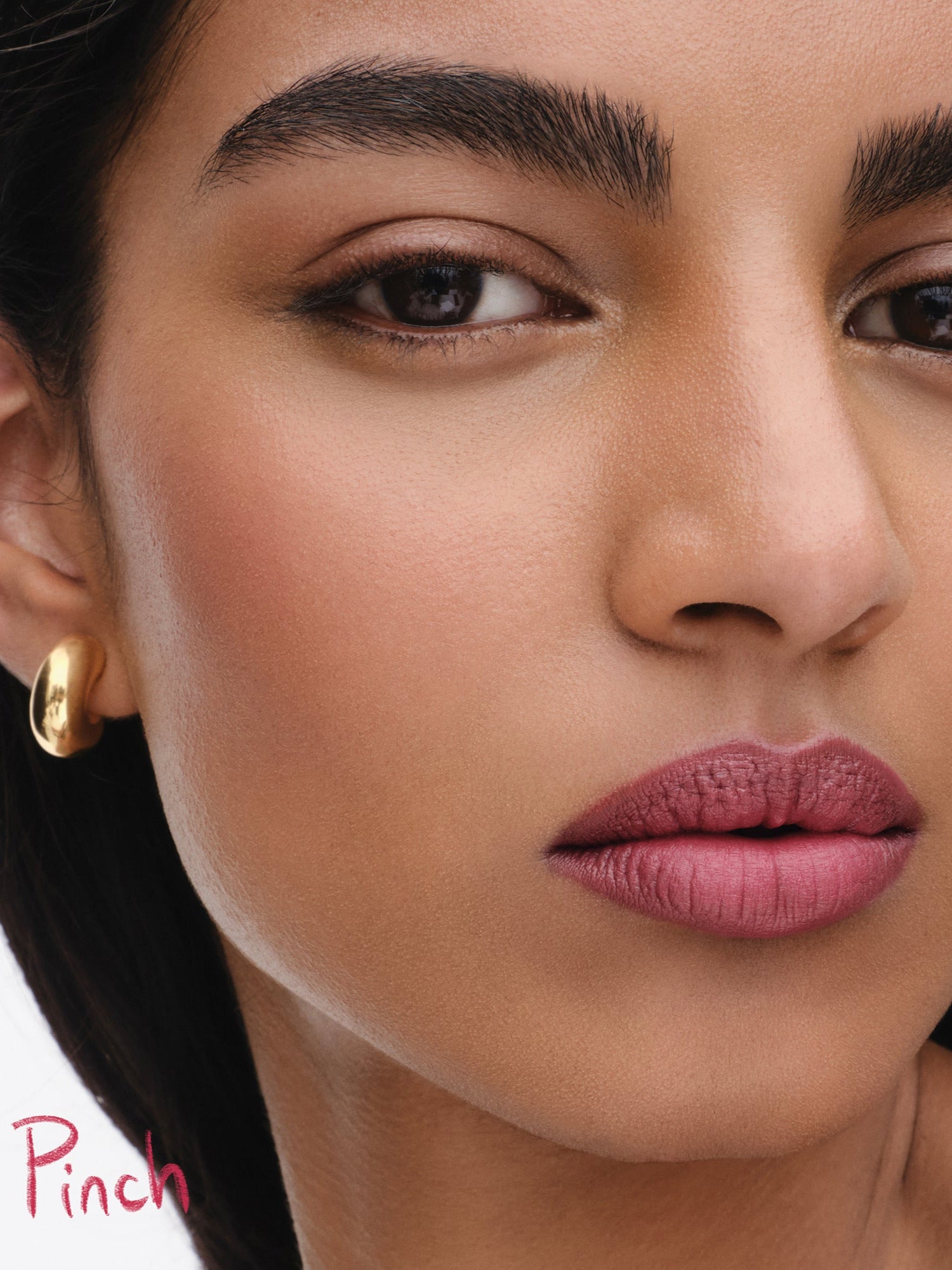 Westman Atelier Lip Suede Matte Lipstick in Pinch on lips