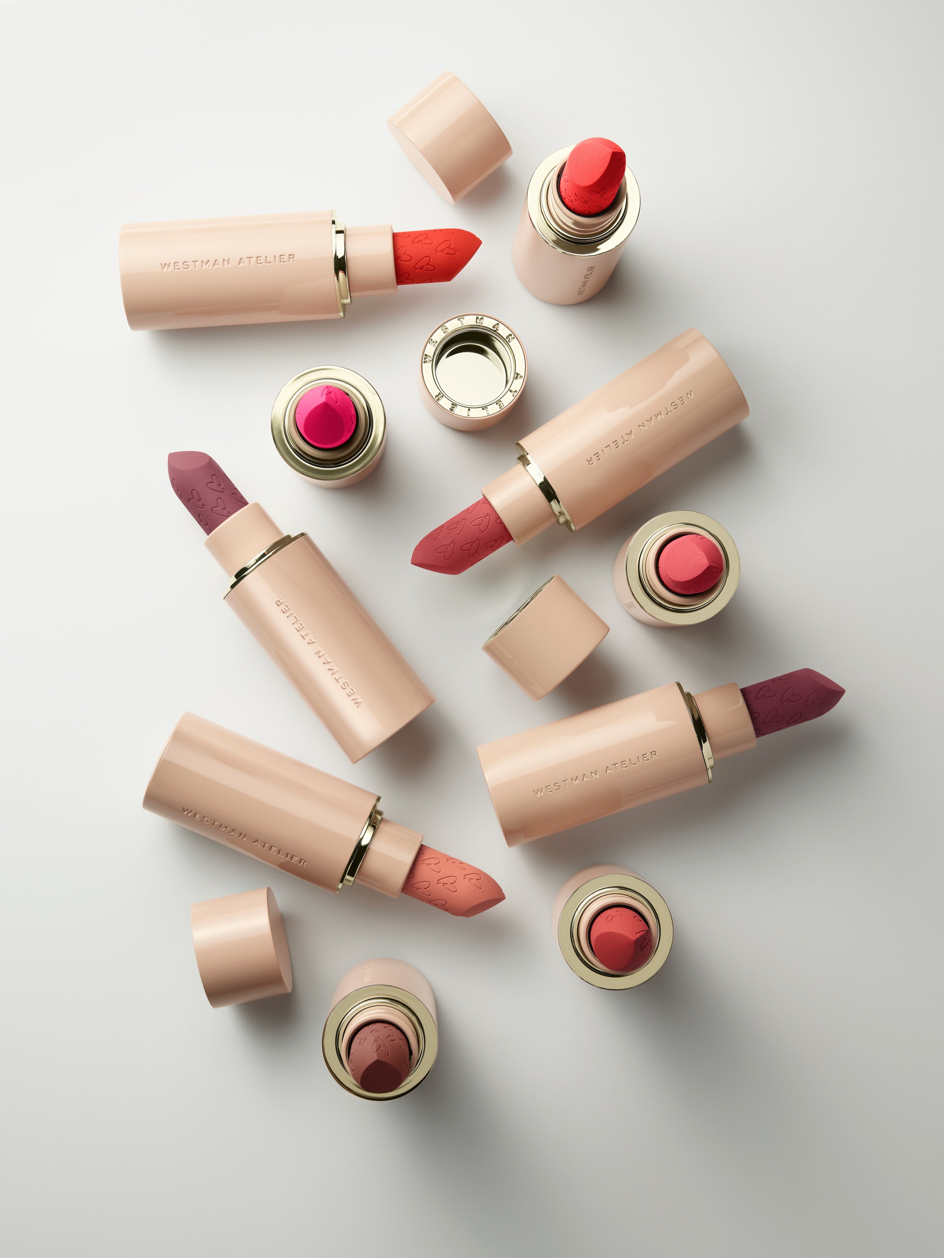 Westman Atelier Lip Suede Matte Lipstick in multiple shades flatlay
