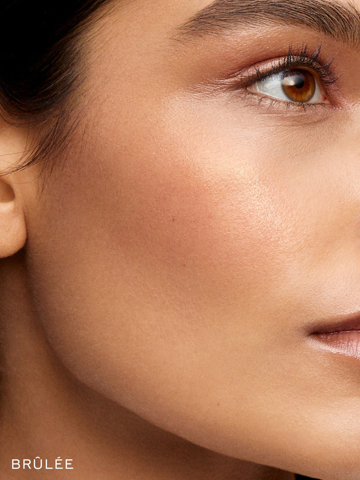 Westman Atelier Lit Up Highlight Stick in Brûlée on model
