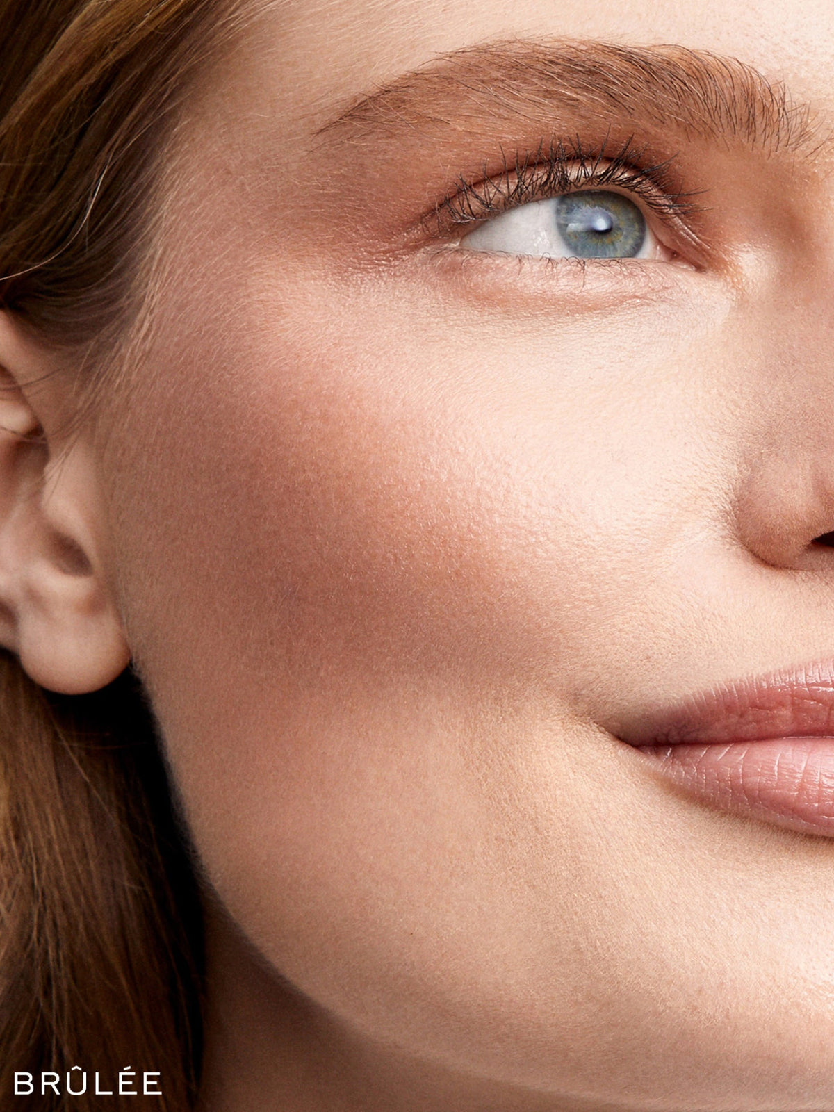 Westman Atelier Lit Up Highlight Stick in Brûlée on model